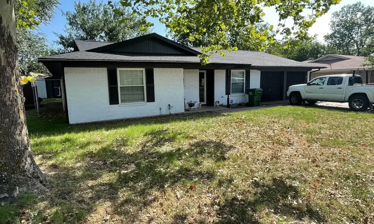Professional roofing crew working on a residential roof in Chantilly